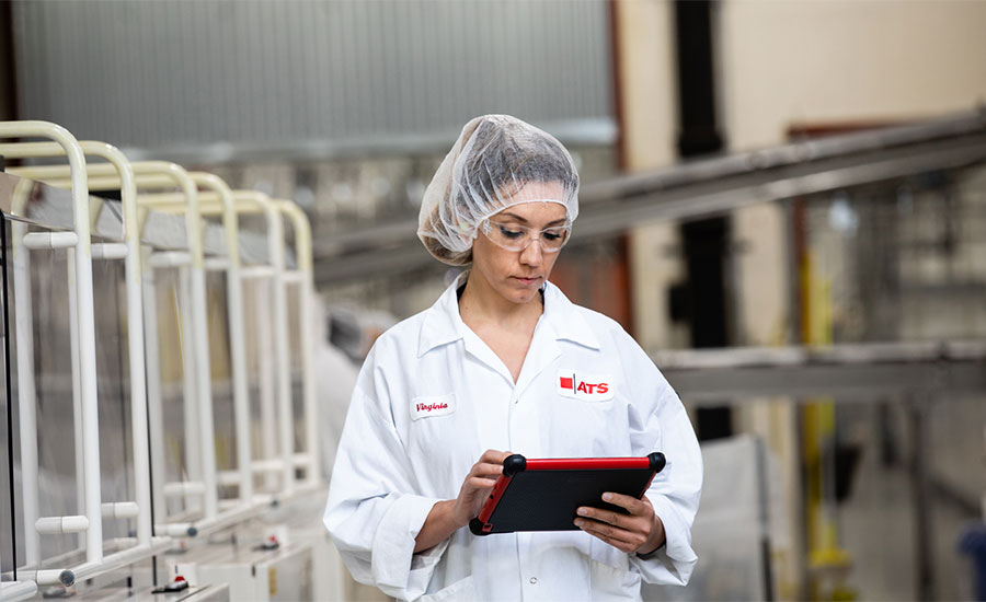 A technician uses a tablet with eFactoryPro