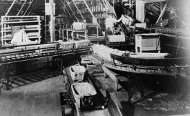 moving assembly line at Ford’s factory in Highland Park, MI