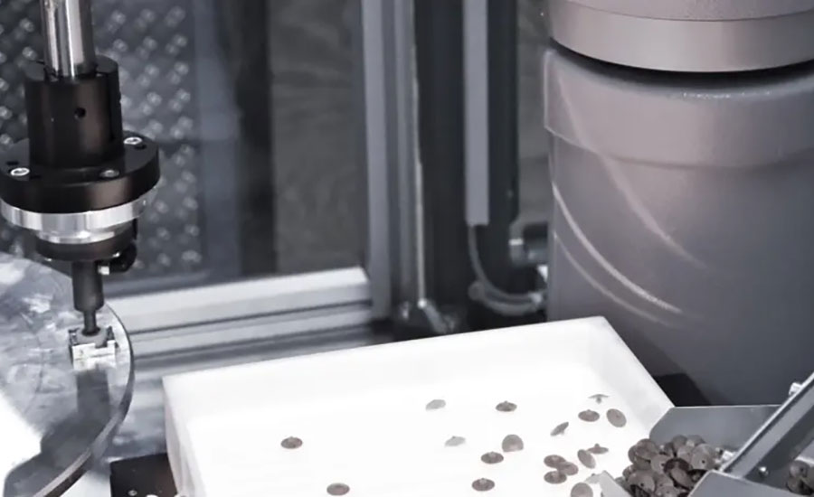 SCARA robot retrieves a membrane from the feeder system