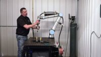 welder programs a cobot